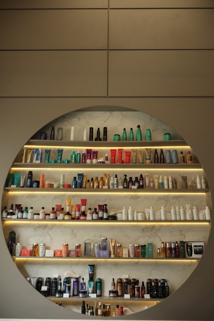 Shelves filled with various beauty products and bottles.